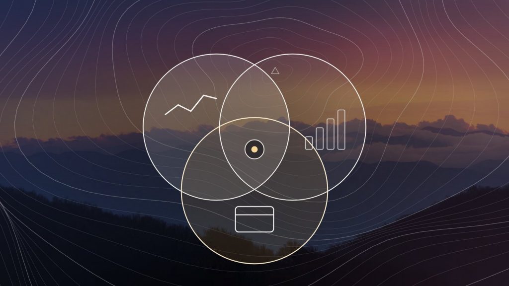 A brass altimeter on a granite ledge above misty mountains, with contour lines and a marked route